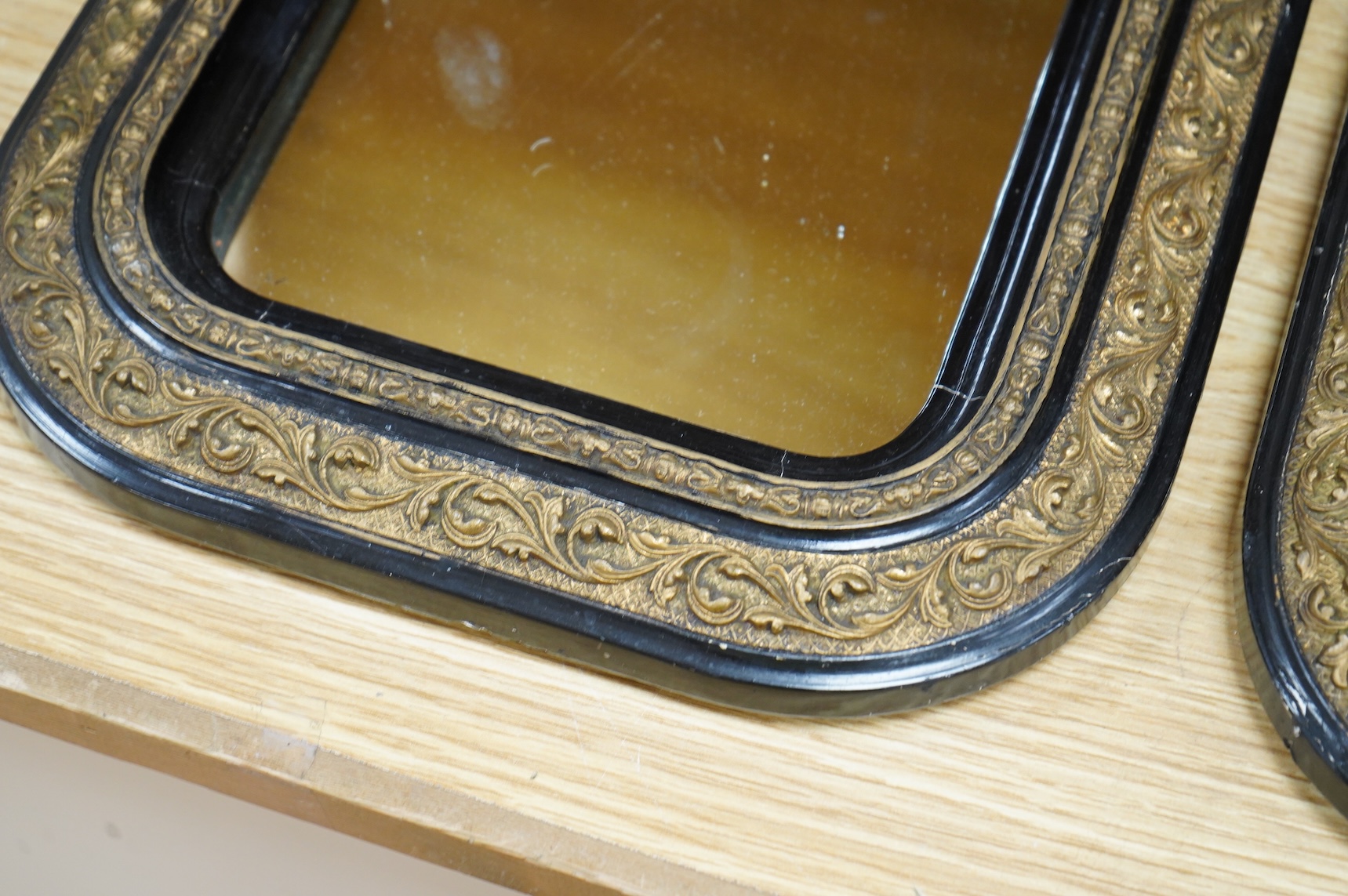 A pair of 19th century French ebonised and gilt wall mirrors, 32 x 27cm